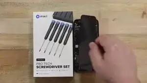 Now that the screen is detached, proceed to remove the proximity sensor. Begin by unscrewing the four screws shown in the reference video. (Keep careful track of each screw’s position, as they vary in size. Installing a screw in the wrong location can cause permanent damage to the Face ID hardware, rendering it inoperable.)