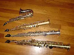 Top to bottom: E♭ sopranino saxophones, curved and straight; soprano saxophones, in C and B♭